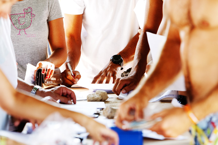 T10 ls Busy hands at registration Busy hands at registration